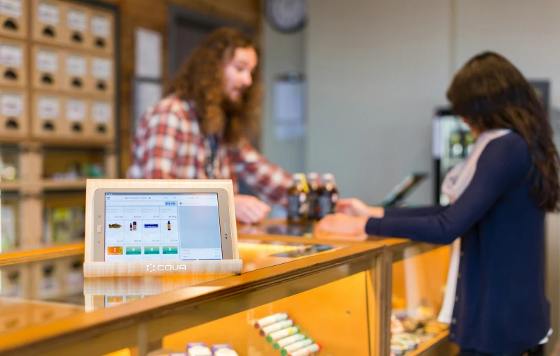 two people at a counter of some sort