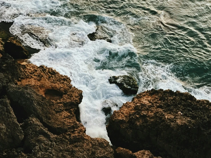 a body of water that has some rocks in it