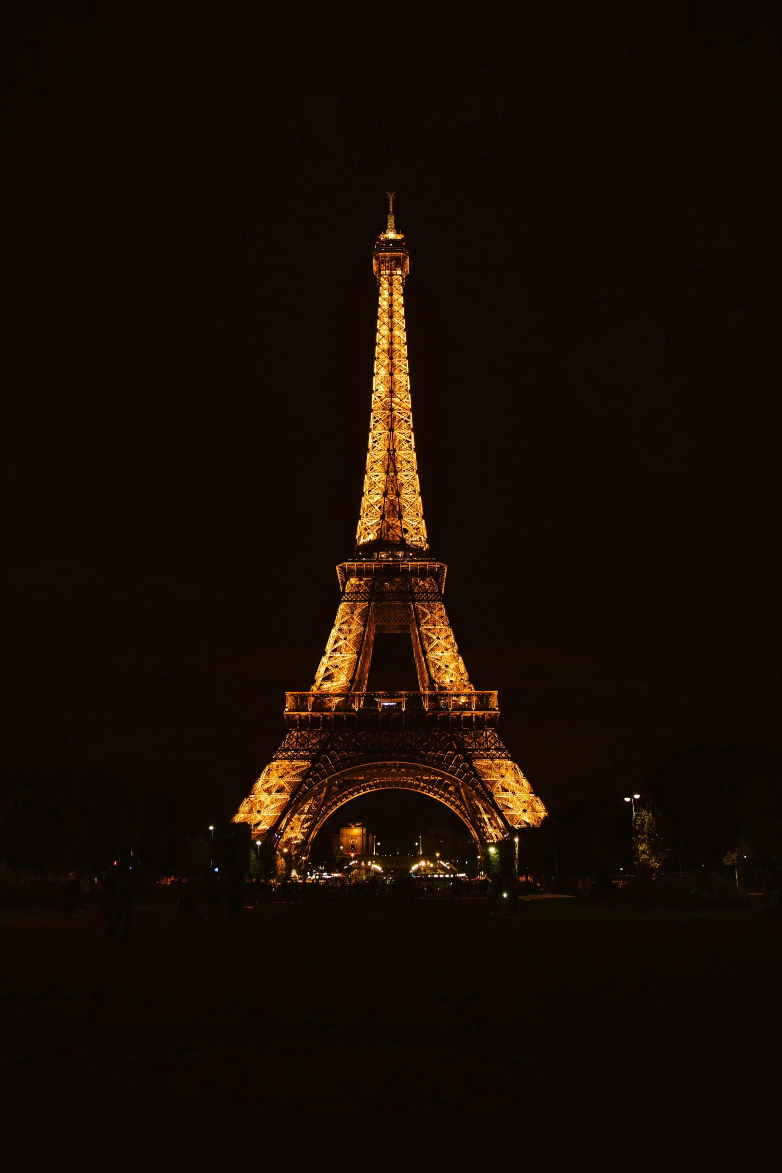 the eiffel tower lit up at night in paris, france