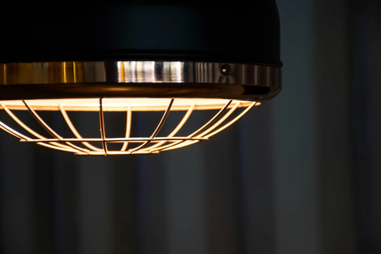 an industrial - styled lamp illuminates light fixtures