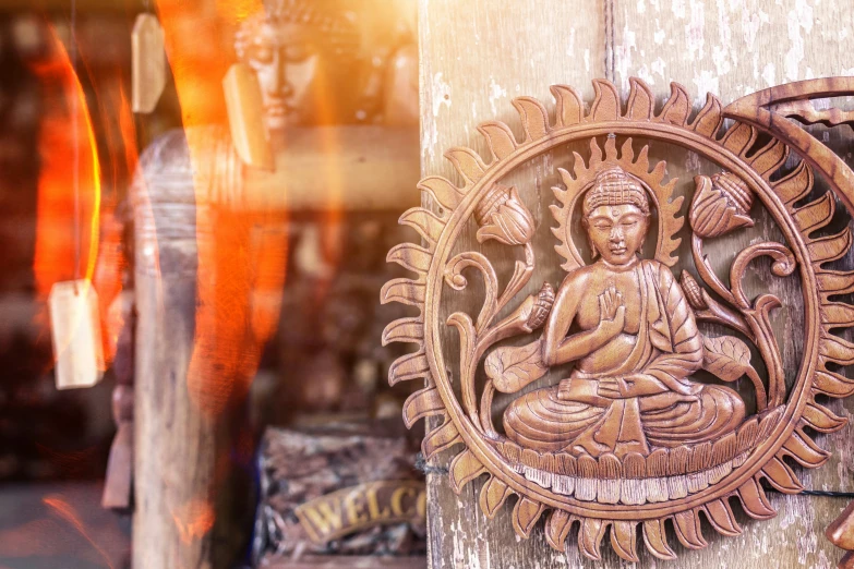 there is a buddha statue on display in the store window