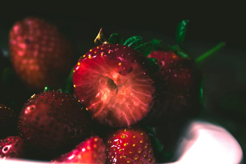 a closeup po of strawberries on a plate