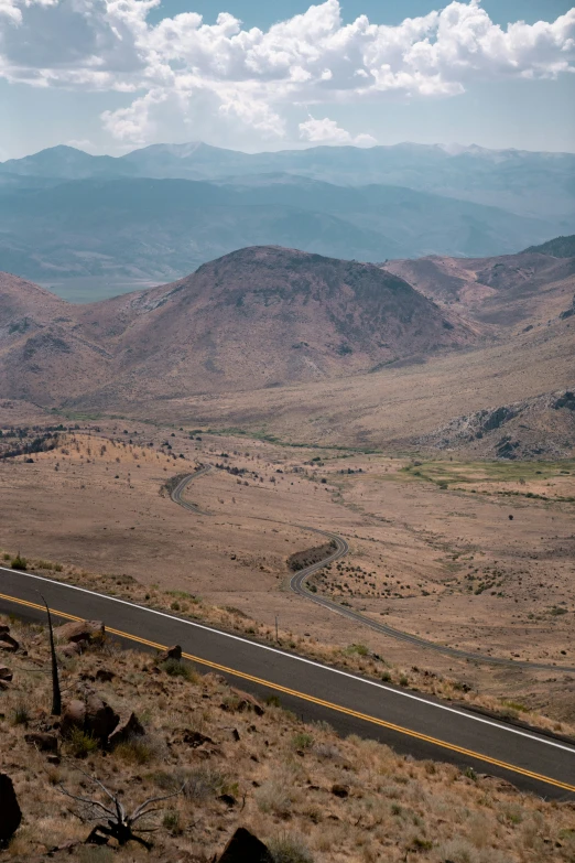 a long road goes into the distance in the desert