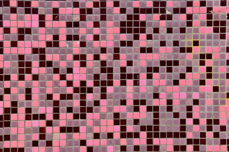 the tiled surface is pink and brown in color
