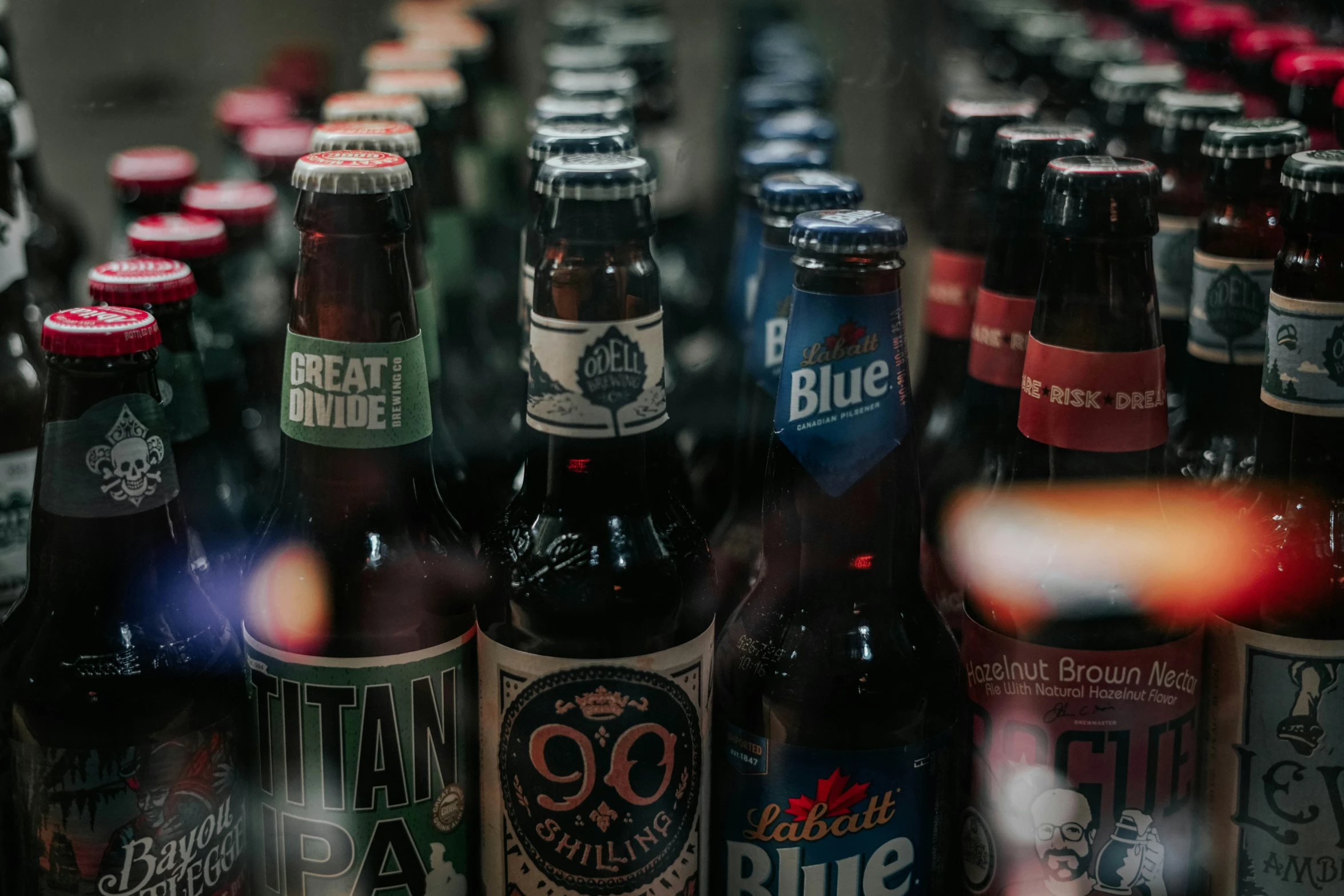 a pile of bottles that are sitting on the counter