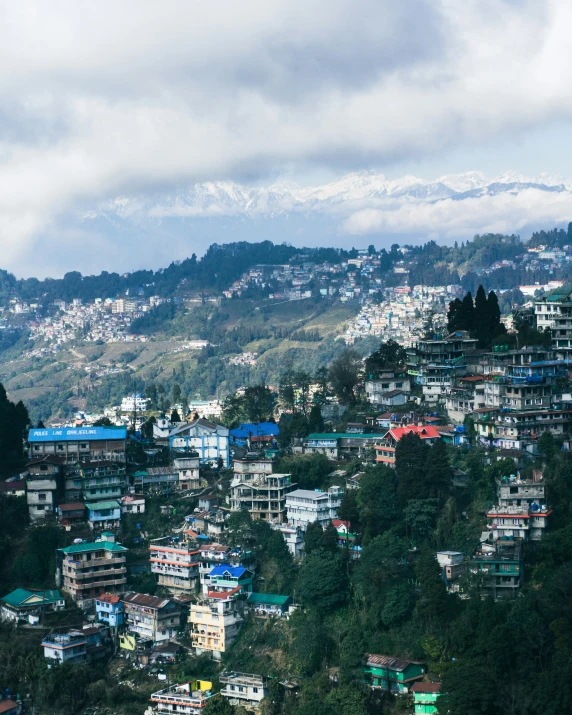 a large group of buildings on top of a hillside