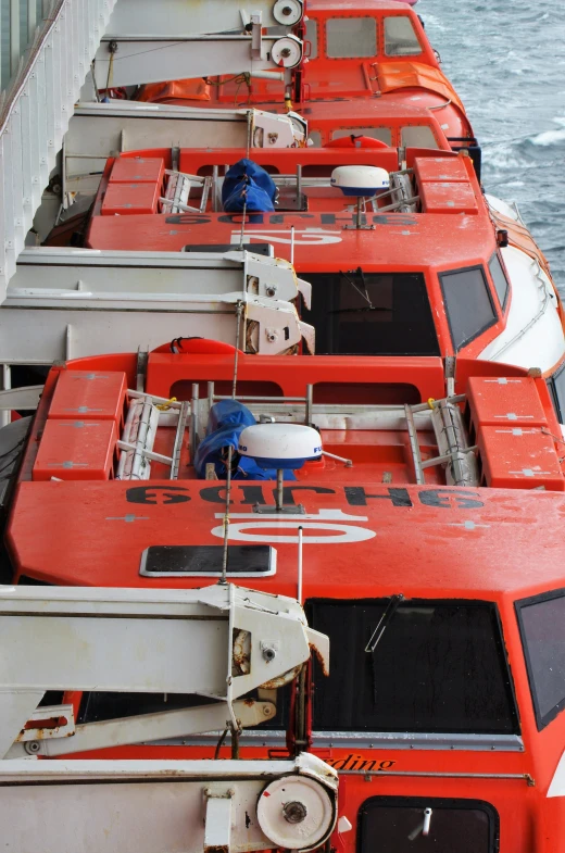 a boat's deck is filled with red and white items