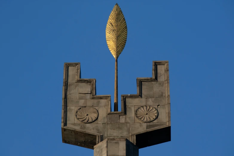 a large white leaf on top of a large building