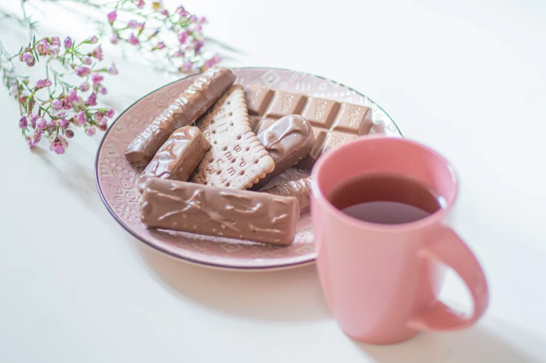 coffee and some marshmallows on a plate