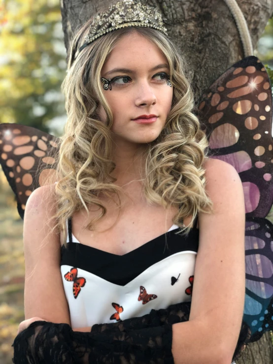 a pretty young woman dressed in erflies for halloween