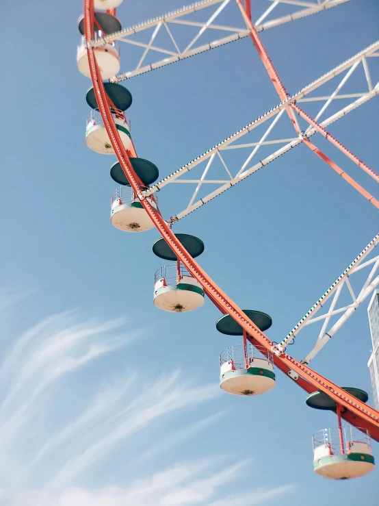 a ferris wheel suspended above another structure