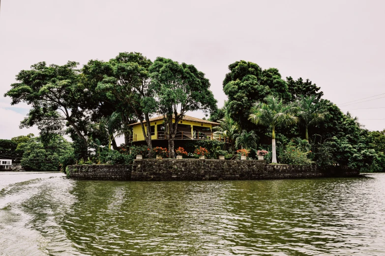 an island is seen in the water behind a boat