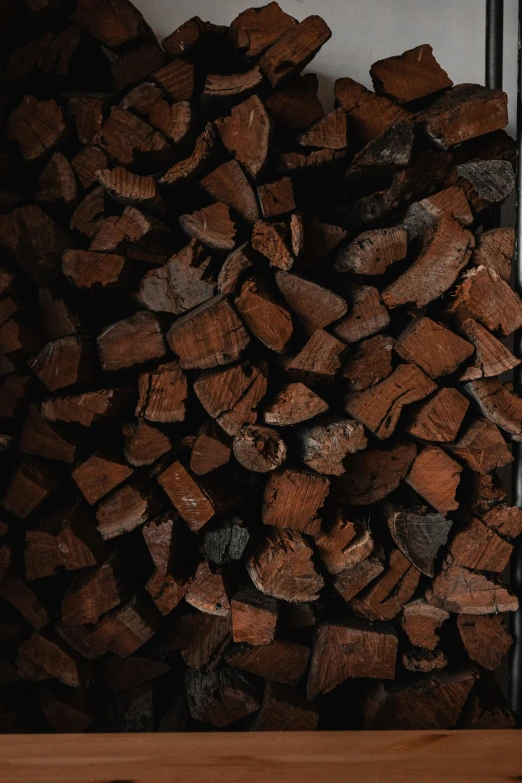 pile of wood with frame and door in the background