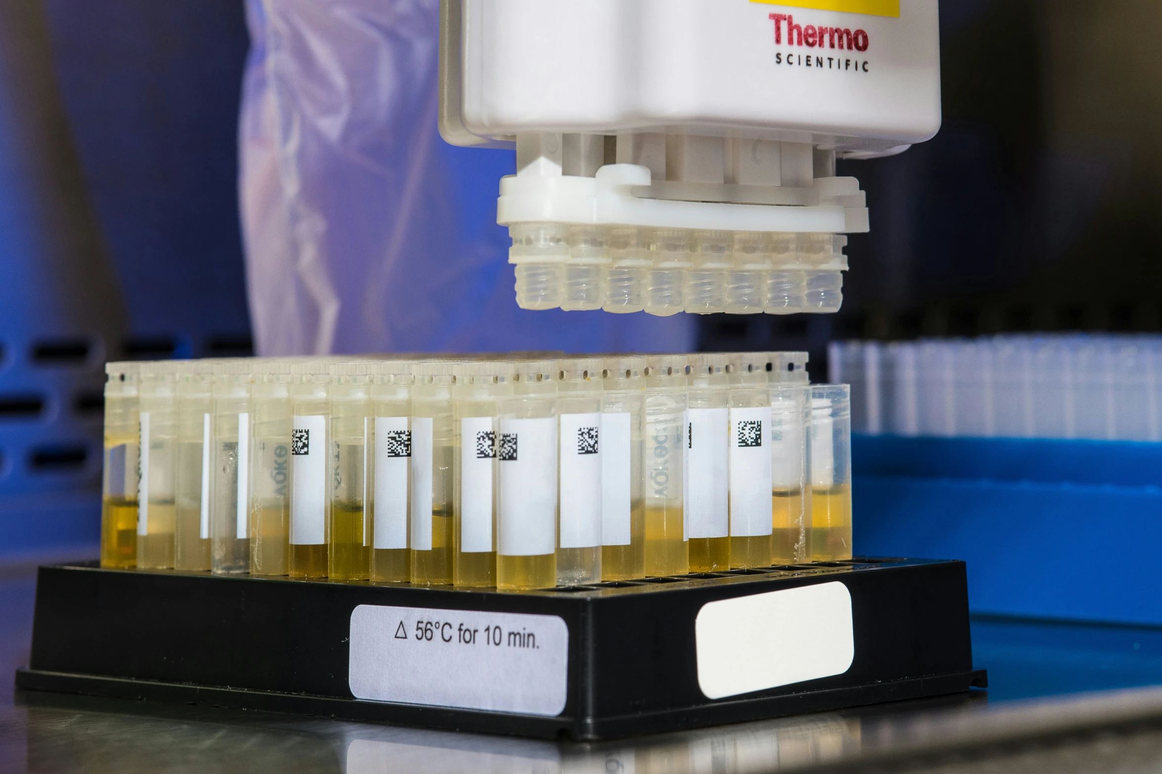 a set of vials of liquid on a shelf