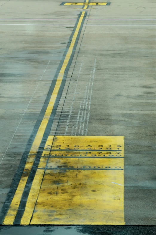 the sun shines on a tarmac that is yellow