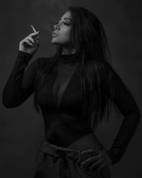 a black and white image of a woman smoking