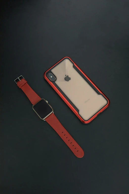 an apple watch and an iphone case laying on the table