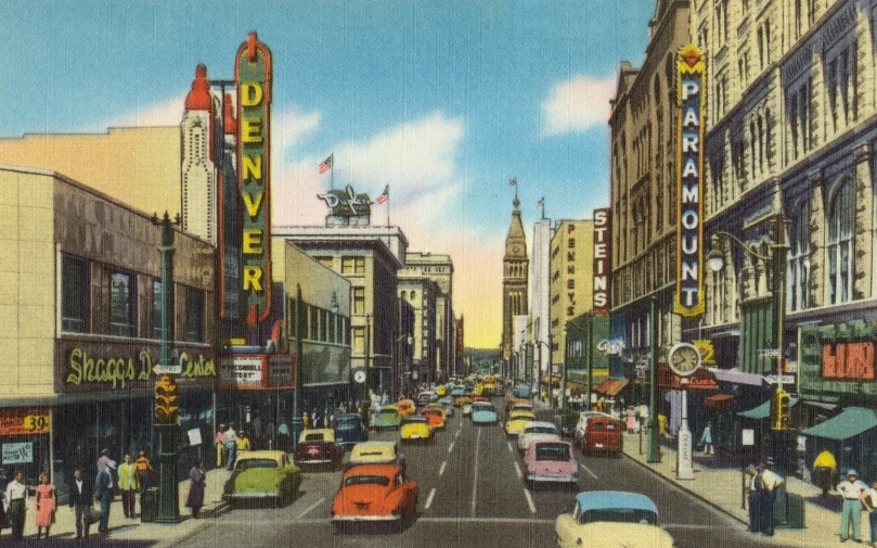 city traffic in front of the theater at the corner