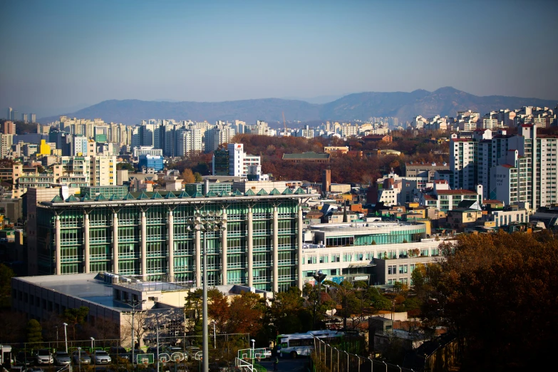 a tall building next to a large city