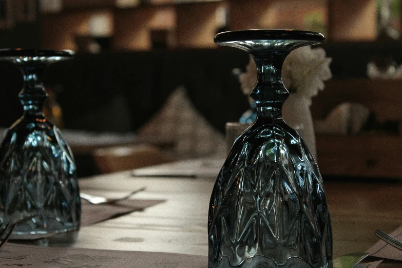 an old fashioned set of three bottles sitting on the ground