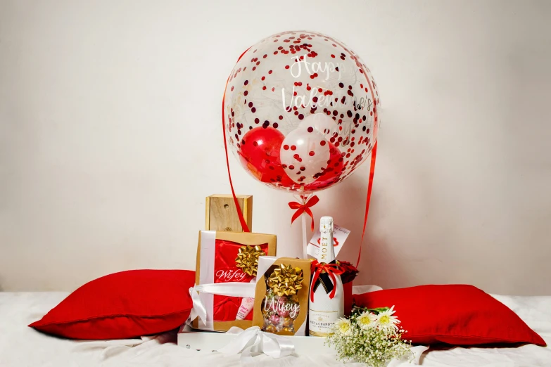 several presents sitting on the floor of a bed