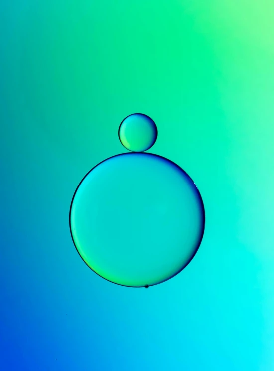 water bubbles floating against the sky in a blue and green background