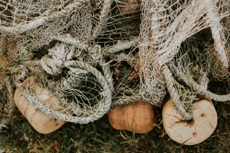 the fish nets are pulled together on the ground