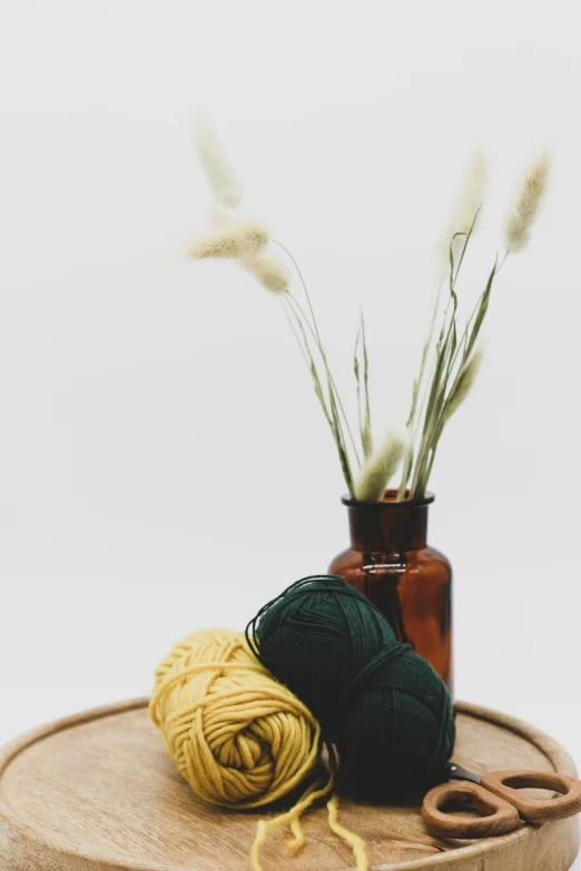 a sprig of plant life on a round table