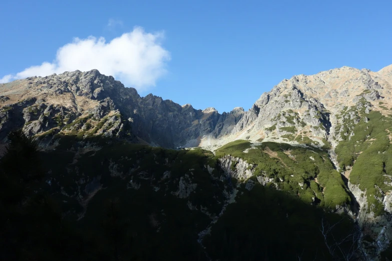 a group of mountain covered in lush green trees