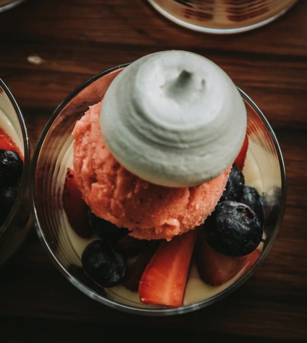 a bowl of fruit with a white lid