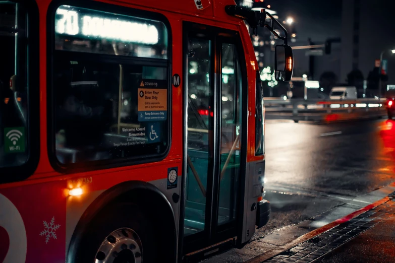 a bus on a road at night with traffic