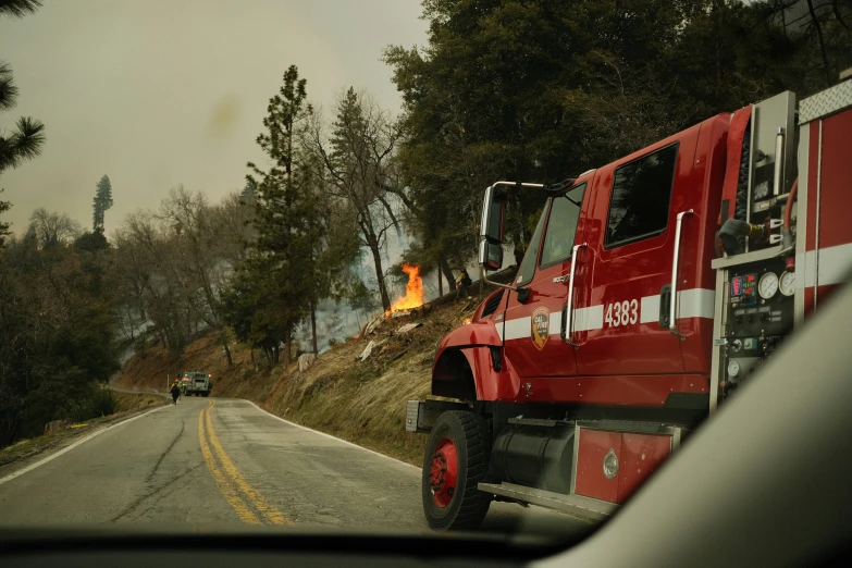 a fire truck that is on the side of the road