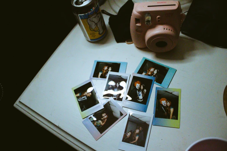 a polaroid is placed next to a camera and other things