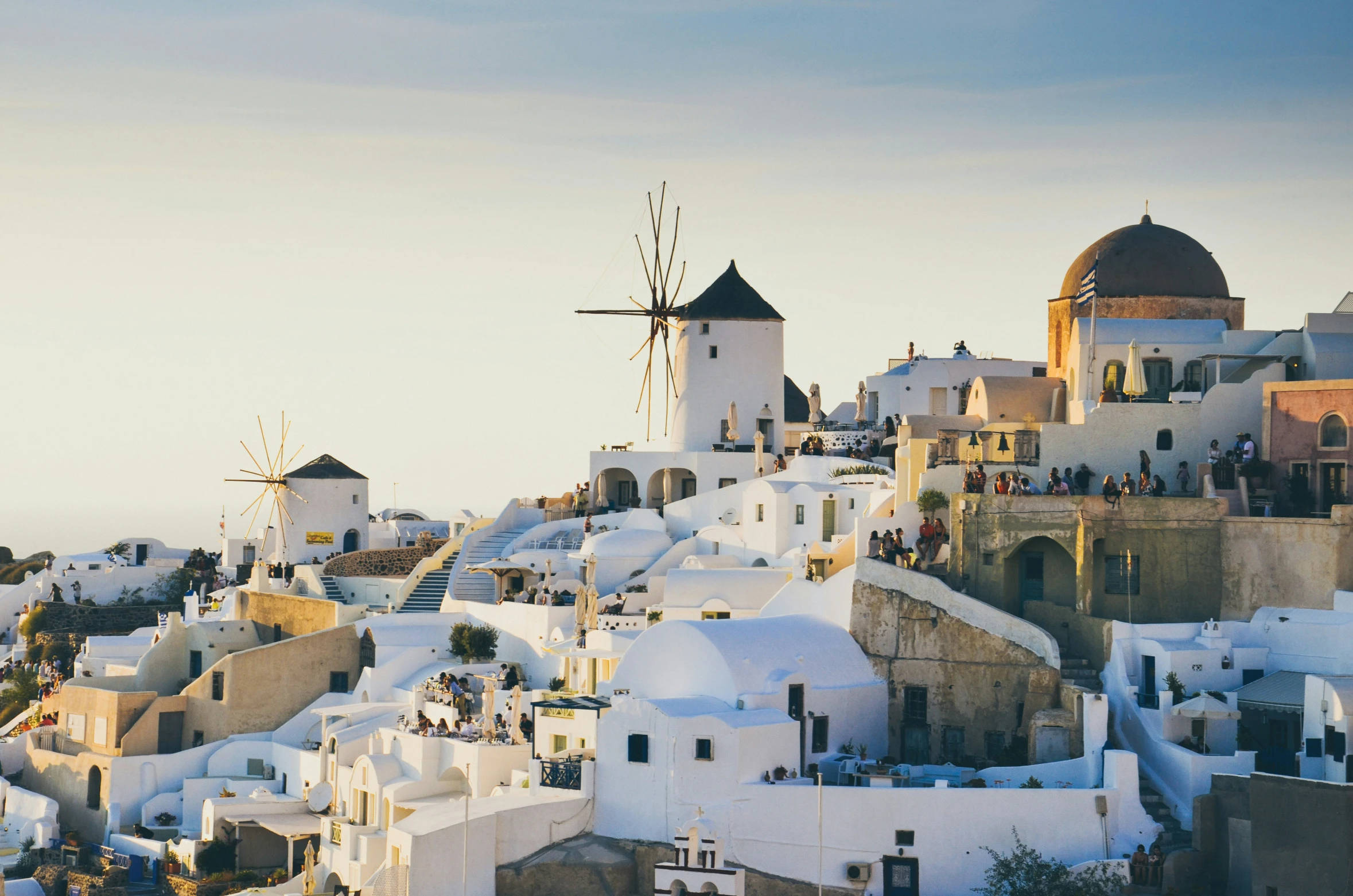 a picture of a town with churches and rooftops