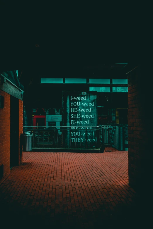 a sign on a brick street in front of a building