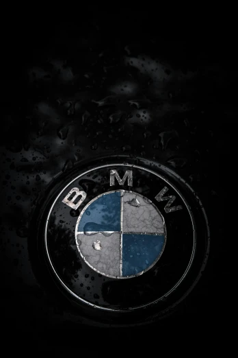 a black picture of the logo of a bmw car