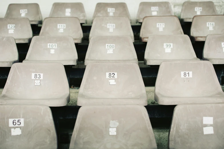 an arrangement of chairs with numbered tags on them