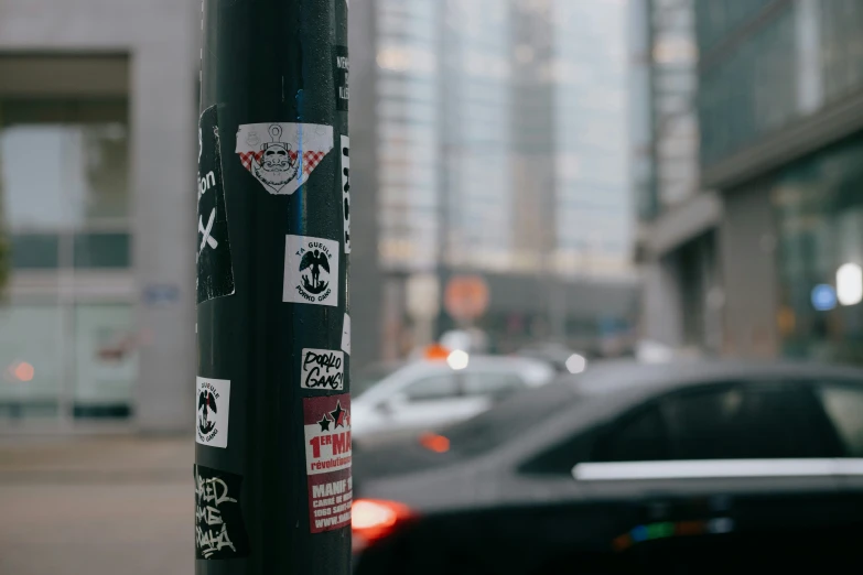 a pole on the side of a city street