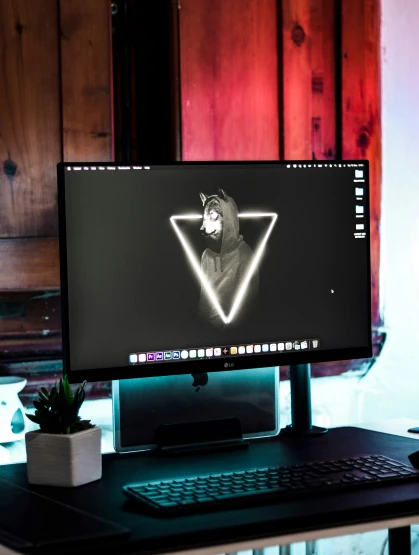 this is a computer with an alien on the screen