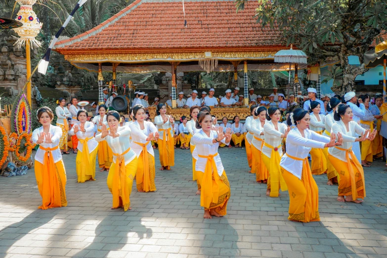 a group of young people wearing yellow dresses