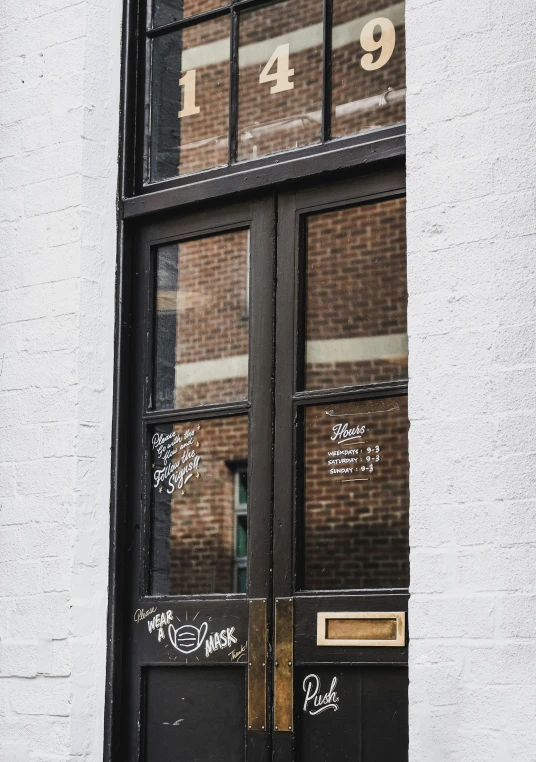 an open black door with some writing on it