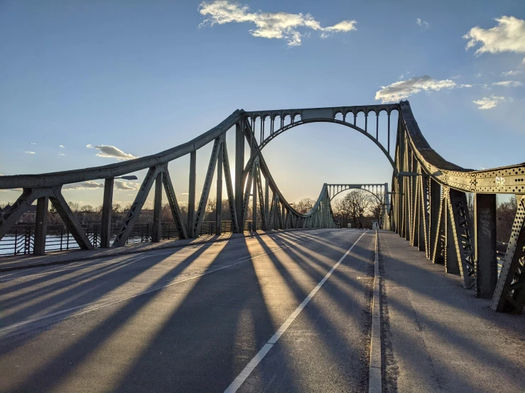 a view of a bridge in the afternoon sun