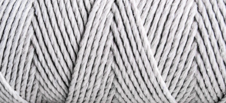 a skein of grey yarn that is white