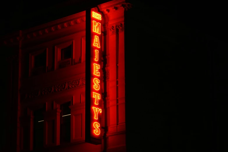 neon el sign glowing in dark building lit up in red