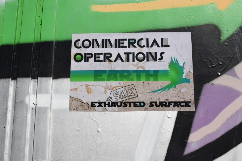 this commercial operation sticker is on a piece of graffiti