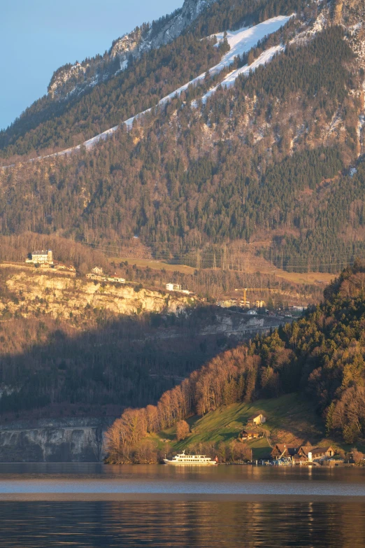 a scenic landscape showing a hillside with some houses on it