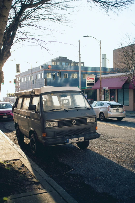 an suv parked in a parking lot beside a sidewalk