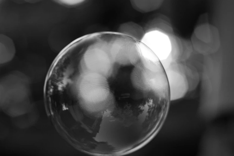 bubbles and blurs are seen in a circular glass bowl