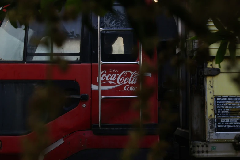 the door to the coca - cola truck is opened