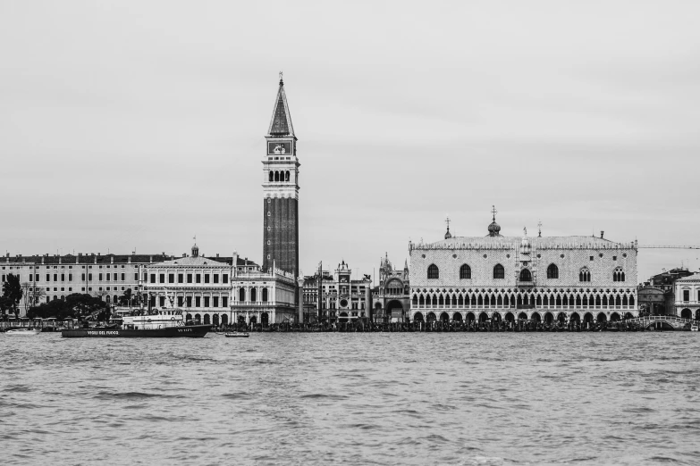 the palace is seen in black and white, as it sits on the edge of a body of water